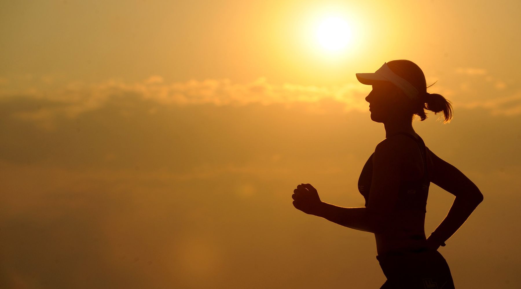 Runner in motion on a road - omega-3 fish oil supplementation for running recovery and reduced muscle soreness
